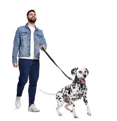 Wall Mural - Young man walking his dog on white background