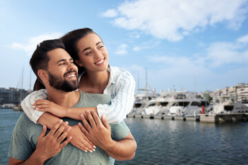 Wall Mural - Happy couple enjoying their honeymoon. Newlyweds during wedding trip