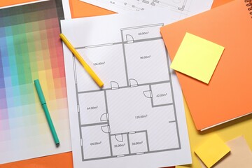 Sticker - Designer's workplace with house plan, color palette and stationery on orange table, flat lay