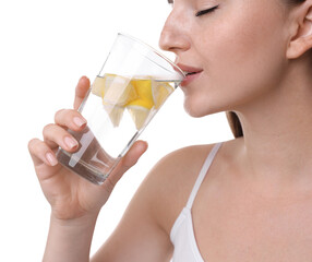 Poster - Woman drinking water with lemon on white background, closeup