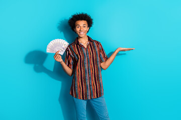 Canvas Print - Portrait of young businessman wavy hair wearing summer shirt holding hand drop shipping deal isolated on aquamarine color background