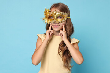 Poster - Happy girl wearing carnival mask on light blue background