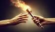 © Nattakarn - Two hands passing a flaming torch in a dark setting..Concept: Hope, inspiration, passing on knowledge, continuation of a legacy.