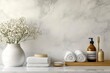 © MUdaylah - Natural white marble bathroom tabletop with bath accessories set and copy space with generative ai