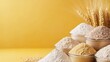 © JoxyAimages - Showing different types of flour in bowls along with wheat stalks, this image captures the natural ingredients essential for baking, set against a bright yellow background.