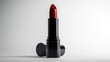 © Lexyat - A single tube of classic red lipstick with its cap off, standing upright against a white background.