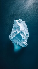 Wall Mural - an aerial view of an iceberg floating in the water, showcasing its massive size and intricate detail