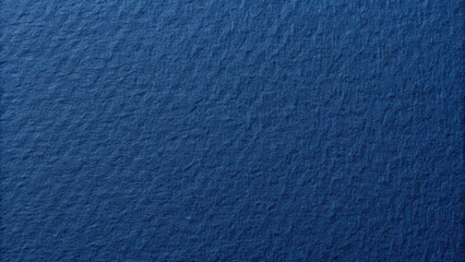 Closeup of the texture of navy blue paper resembling dense cardboard