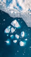 Wall Mural - an aerial view of an iceberg floating in the water, showcasing its massive size and intricate detail