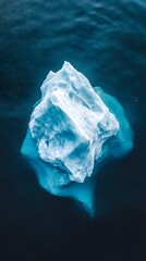Wall Mural - an aerial view of an iceberg floating in the water, showcasing its massive size and intricate detail