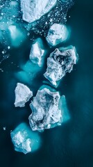 Wall Mural - an aerial view of an iceberg floating in the water, showcasing its massive size and intricate detail