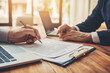 © SITI - Businessman Signing Contract Document in Office, Close-up of Hands and Pen, Professional Agreement