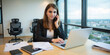 © Aleksandr - A confident businesswoman is discussing a new strategy over the phone in a bright and productive office.