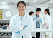 © peopleimages.com - Portrait, arms crossed or woman with smile in laboratory for science breakthrough, clinical trial or discovery. Medical, proud or happy scientist with vaccine research, cure or disease development