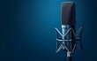 © Mahmud Creative - Professional condenser microphone on a blue background with copy space for text.