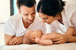 © SensSai/peopleimages.com - Parents, happy and baby for care, bonding and development with support, love and relax in home. Newborn, family and smile for connection, growth and nurture with protection, play and people in house