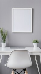 blank photo frame mockup on grey wall with minimal white desk and plant decorating