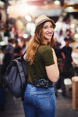 Poster - Woman, travel and portrait at market with backpack, smile or tourism on journey, holiday and shopping. Girl, photographer and happy with camera at outdoor shop for deal, discount and excited in Italy