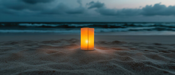 Wall Mural - A small candle is lit on a beach at night