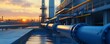© Aris Suwanmalee - Industrial pipeline system at sunset, showcasing modern technology and infrastructure in oil and gas production.