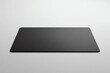 © Arbystudio - Black Rectangular Mouse Pad on a White Surface