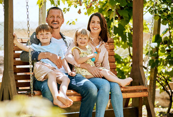 Wall Mural - Portrait, swing and parents with kids in garden for bonding, fun relationship and relax together. Backyard, happy family and mom, dad and children on bench with smile for playing outdoors on weekend