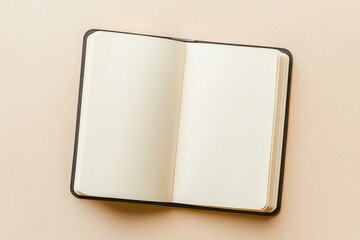 Open Notebook with Blank Pages on a Beige Background