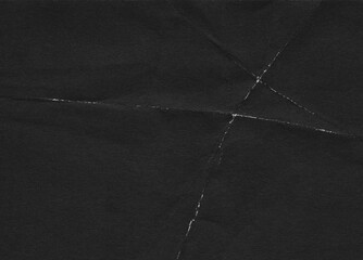 Folded paper black grunge texture with worn, rubbed and torn effect, old retro 90s texture for greeting cards, posters, web landings and other artworks