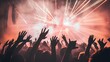 © Raffaza - Silhouettes of a crowd with raised hands at a concert with bright stage lights.