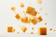 © Alena - A close-up view of various types of cheese cubes suspended in mid-air, great for food-related or playful scenes