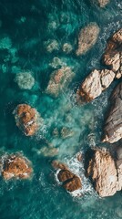 Poster - Aerial view of turquoise water crashing against rocky coastline. Summer vacation, travel, ocean, sea, nature, beach, coastal, tropical, waves