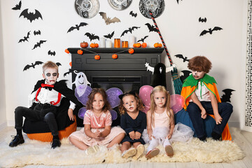 Sticker - Funny children wearing costumes for Halloween celebration in decorated room