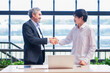 © Verin - professor doing handshake after giving advice university student,young asian man standing and conversation with advisor teacher