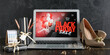 © Pixel-Shot - Laptop with Black Friday sale advertisement, shoes, jewellery and gift boxes on dark wooden table