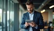 © zettar - A man in a suit is looking at a tablet