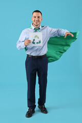 Poster - Male engineer in superhero cape with recycle sign on blue background