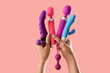 © Pixel-Shot - Woman with different vibrators and anal plug on pink background