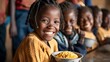 © KHF - Joyful African school children sharing a meal, representing issues of hunger and food scarcity in African countries.
