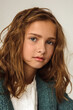 © Cavan Images - Portrait of a beautiful smiling 7 years old girl. Close-up, studio.