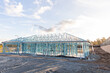 © Austockphoto - steel frame of a house under construction in the afternoon light