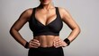 © Animaflora PicsStock - young slim woman with big bust size in black sportswear with a fit body with muscles