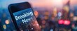 © AQ Arts - A news app on a smartphone showing a 'Breaking News' notification with a blurred cityscape background, highlighting how news is consumed on-the-go.