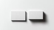© VISUAL BACKGROUND - Two white square paintings on a white wall