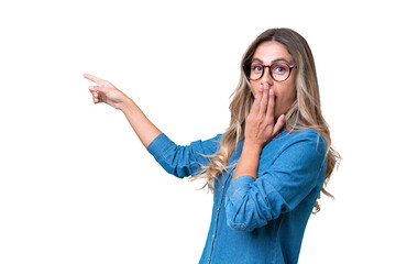 Wall Mural - Young Uruguayan woman over isolated background with surprise expression while pointing side