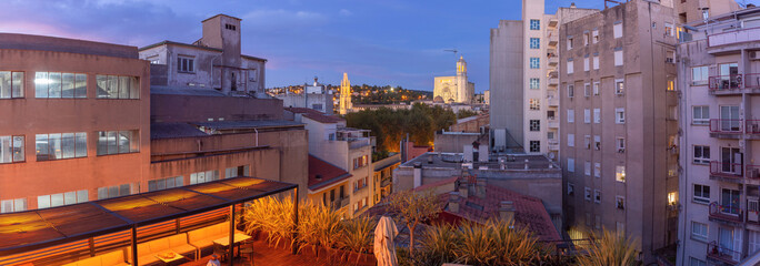 Wall Mural - Panoramic Rooftop View of Girona Cityscape at Twilight with Cathedral, Spain