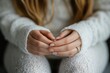 © Anatoll Paveel - Close-up of a woman's hands taking off her wedding ring, indicating problems in a relationship.