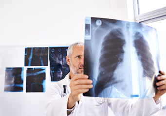 Wall Mural - Xray, radiology and healthcare with doctor in hospital for medicine, results and tumor detection. Medical, insurance and lung cancer with mature man and scan for pneumonia or disease screening