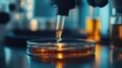 © Phattarasaya - Clear liquid being dropped into a petri dish from a pipette, with focus on the precision and sterile lab environment.