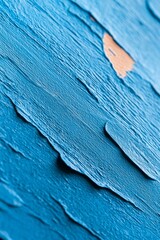  A detailed view of blue paint featuring a single brown speck in its center Brown speck present, centrally located within the blue expanse