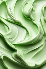 Wall Mural -  A tight shot of a green frosted cake, adorned with intricate swirls on its peak icing